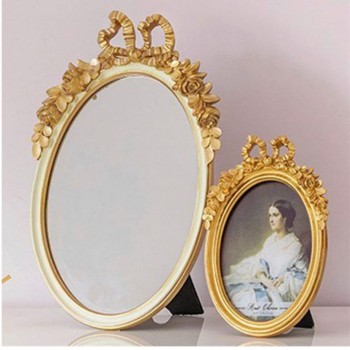 برواز بمرايا ذهبي بفيونكه  