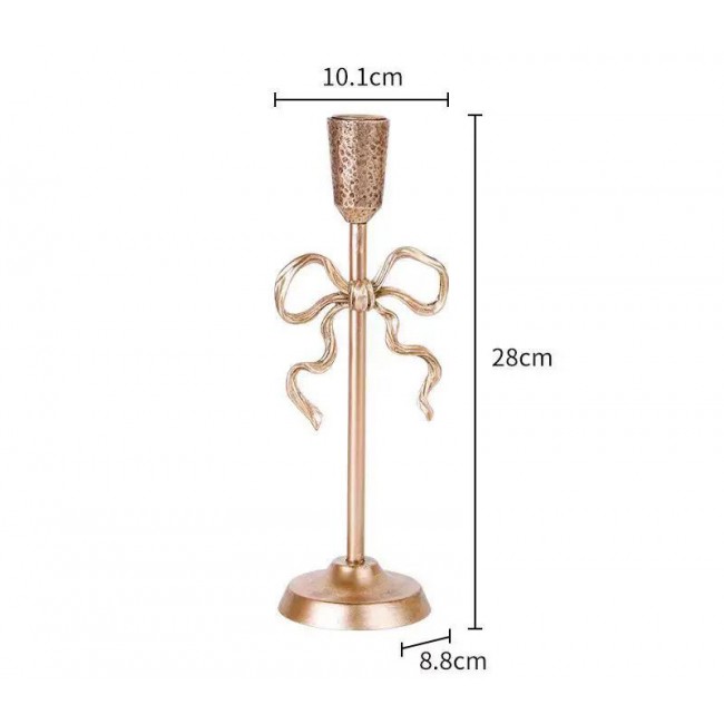 شمعدان ذهبي بتصميم الفيونكة لمسة من الرقي والشاعرية على منزلك، حيث يجمع بين الفخامة الكلاسيكية وجمال التفاصيل المنسوجة يدوياً متوفر الحجمين L9575 شمعدان ذهبي بتصميم الفيونكة لمسة من الرقي والشاعرية على منزلك، حيث يجمع بين الفخامة الكلاسيكية وجمال التفاصيل المنسوجة يدوياً متوفر الحجمين L9575