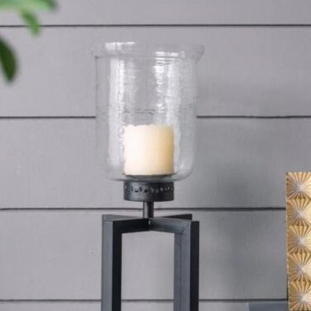 شمعدان زجاجي شفاف بقاعده من المعدن الاسود بتصميم مميز 8396